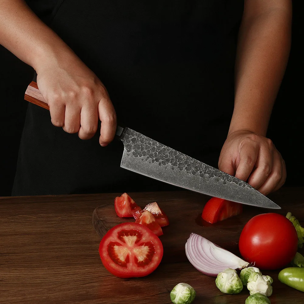 Professional Knife easily cutting tomatoes