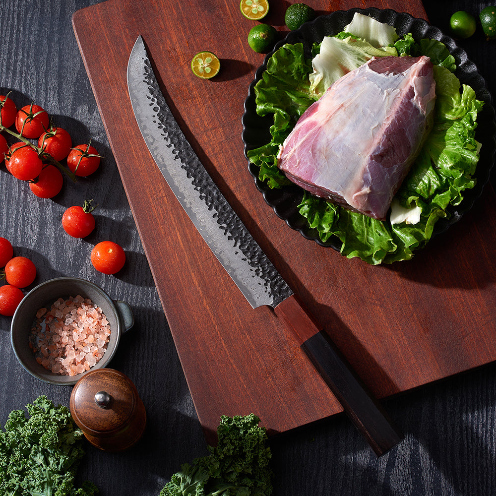 Beautiful japanese damascus knife slicing meat on wood board