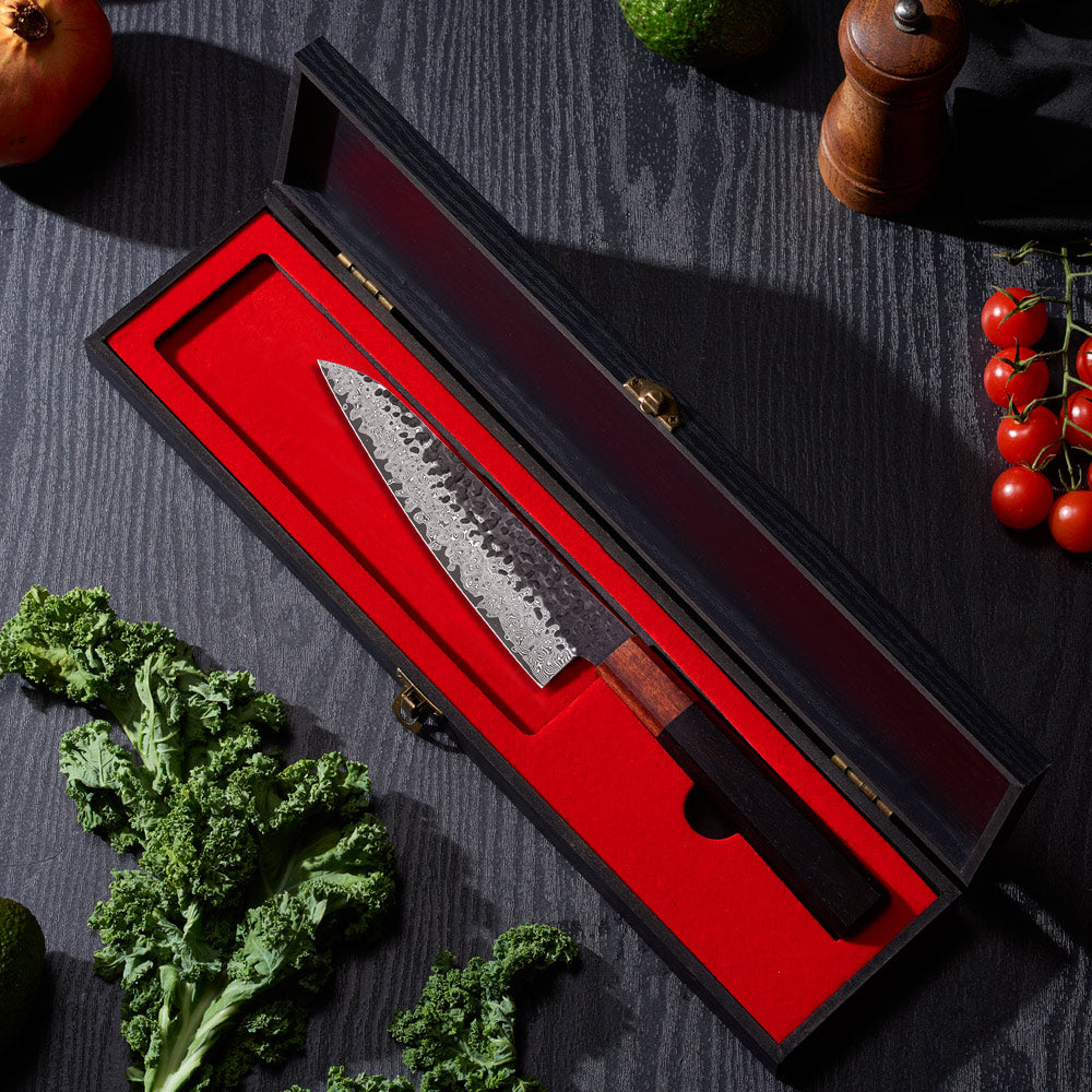 Japanese Damascus knife in box near vegetables