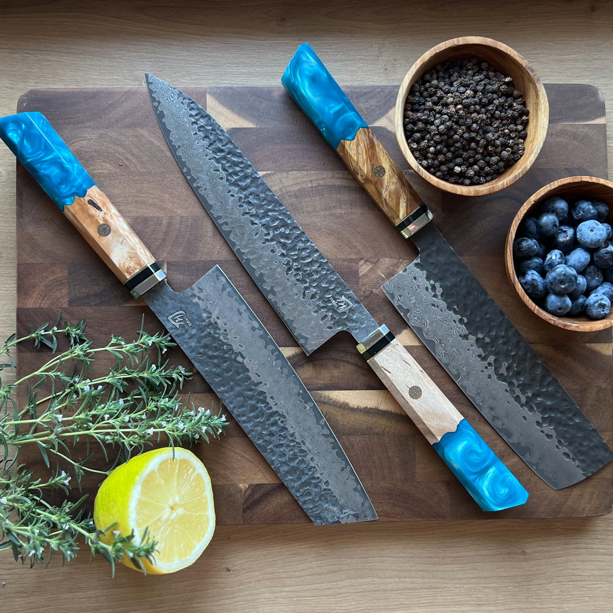 Collection for japanese knives with blue resin handle and damascus