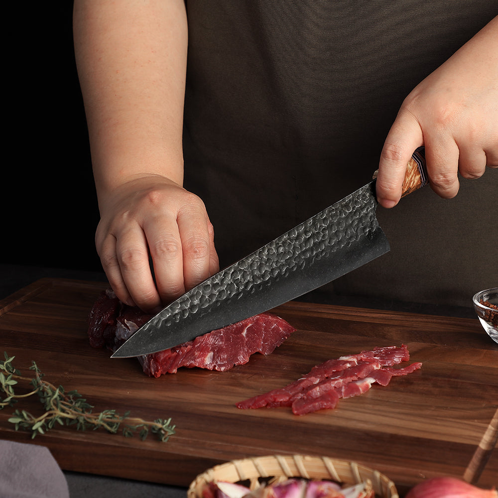 japanese chef cuts steak with kiritsuke chef knife