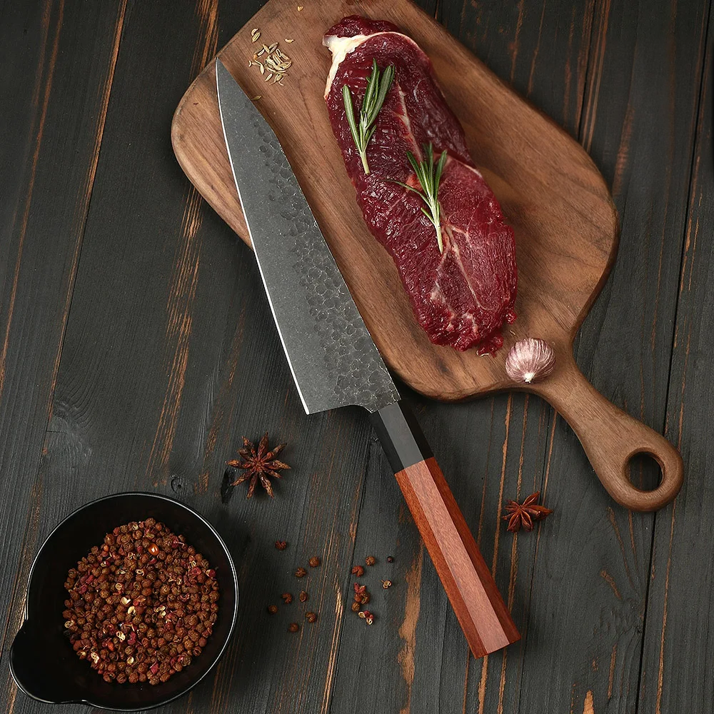 Kiritsuke Professional japanese knife on a wooden board near a steak