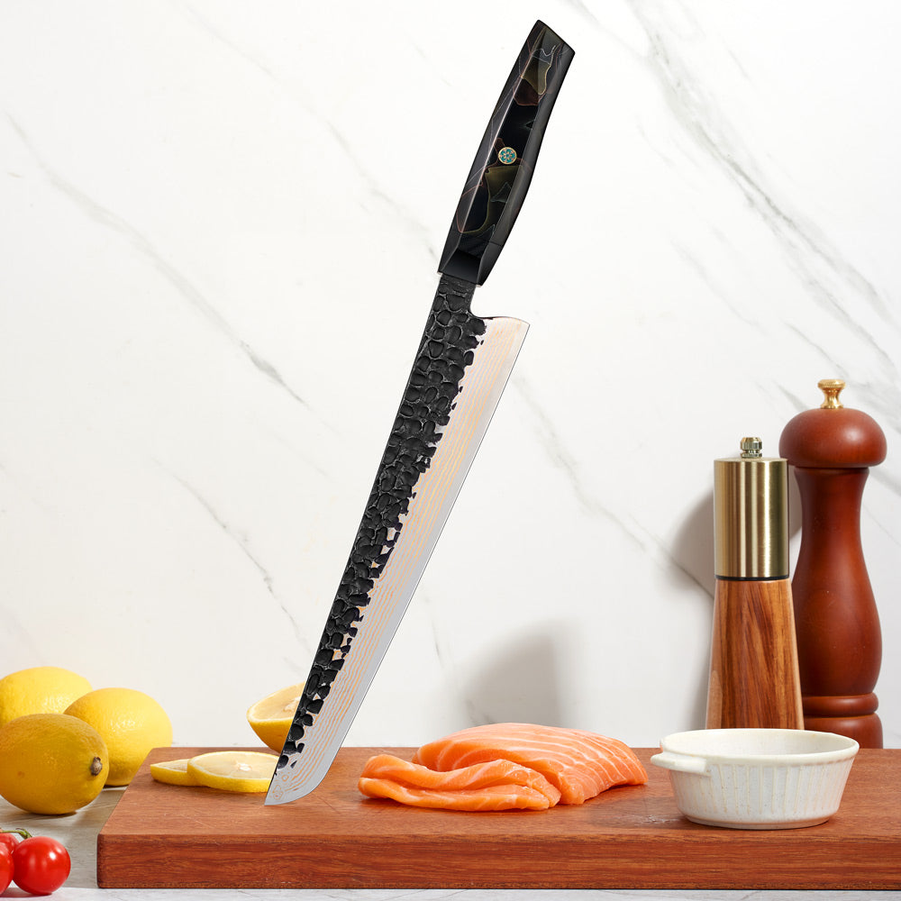 slice / slaugther damascus knife on a cutting board with salmon, lemons, and a pepper grinder.