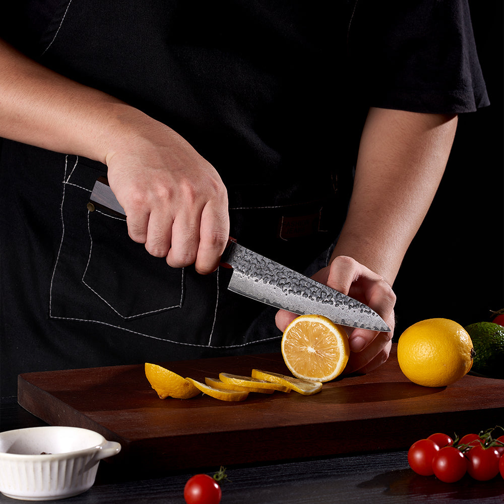 Damascus knife easily slices through lemon